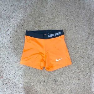 Orange Nike pro shorts